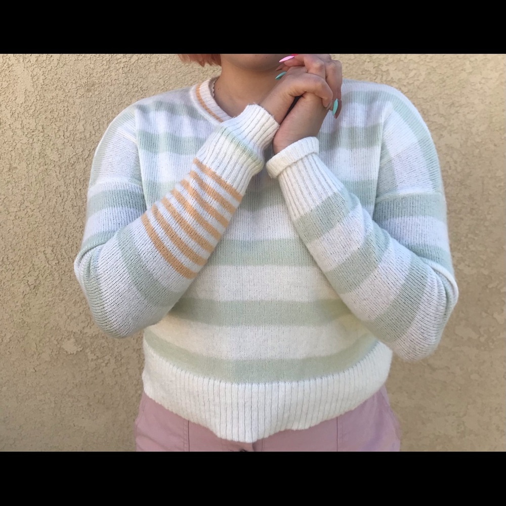 orange and green striped sweater